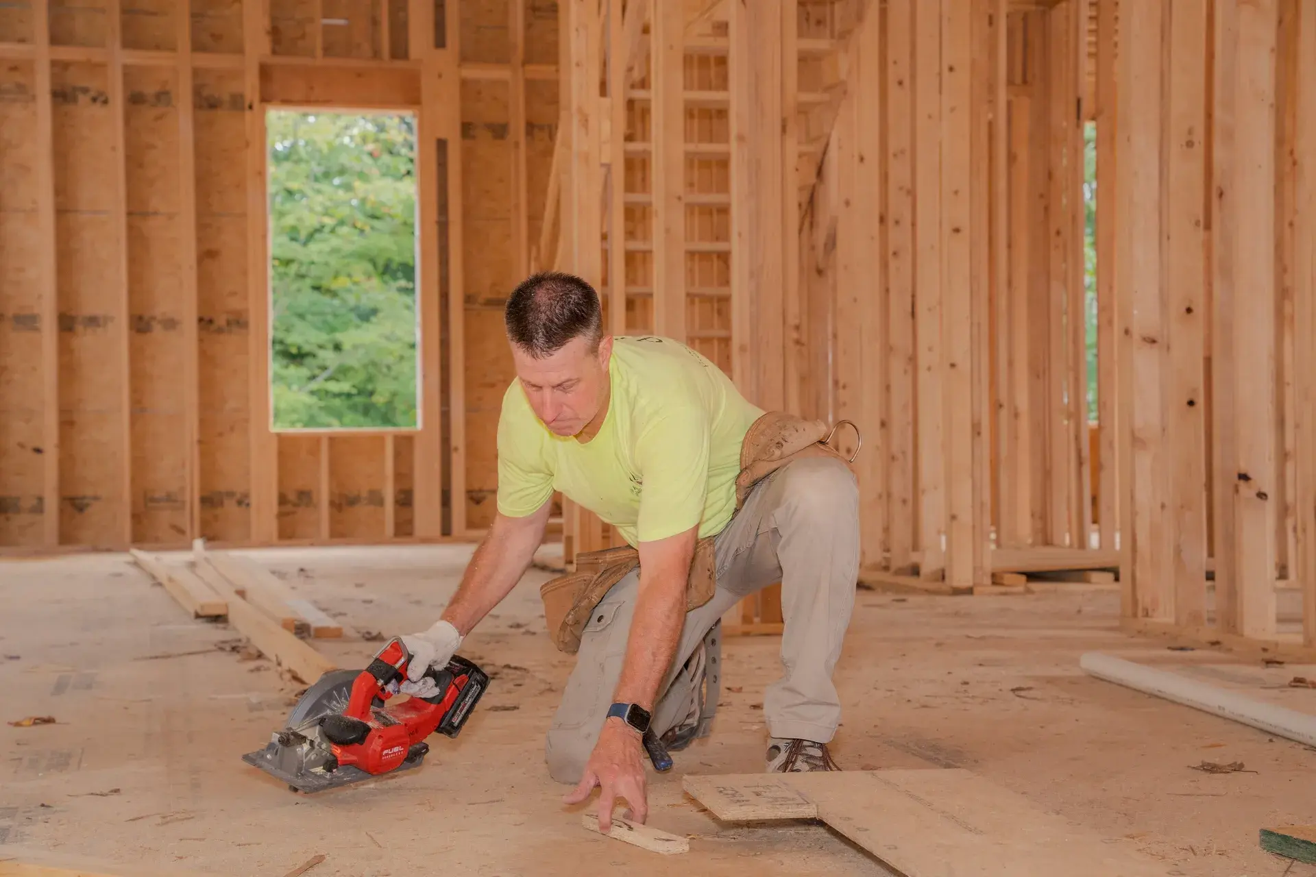Lance DiRenzi Cutting a piece of wood with a saw